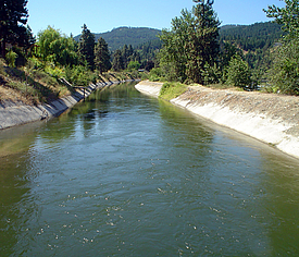 Water channel in Dryden sealed on the banks with concrete mats