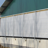 Roll-up ventilation system in a barn by Huesker