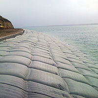 Sandbags at the water's edge for bank protection