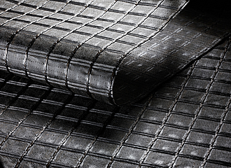 Close-up of HaTelit® asphalt reinforcement grid in road renovation