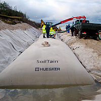 Installation of SoilTain drainage hoses for flood protection