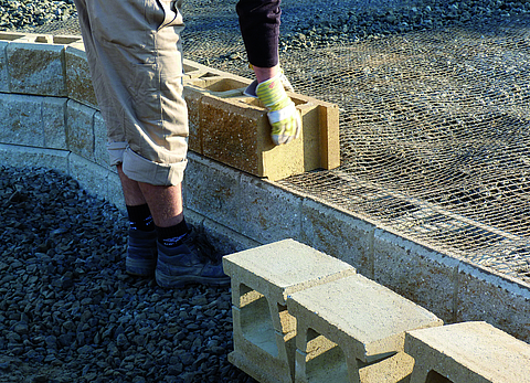 A close-up of the construction of a reinforced retaining structure.