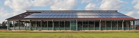 Picture of a modern barn with Lubratec® ventilation products for natural and active ventilation