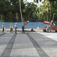 Fortrac geogrid is being laid for soil reinforcement