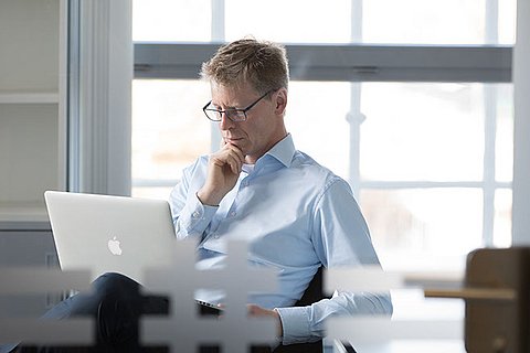 Person works on laptop