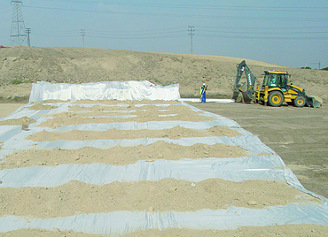 Several layers of topsoil spread by an excavator on Stabilenka