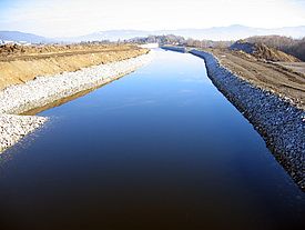 Water channel sealed with concrete mats and riprap revetment at Ritzersdorf power plant