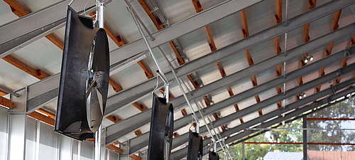 Lubratec axial fan Axial-flow fans hang on the long side of a dairy barn