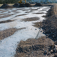 Basetrac Grid on construction site with partial covering by sand and gravel